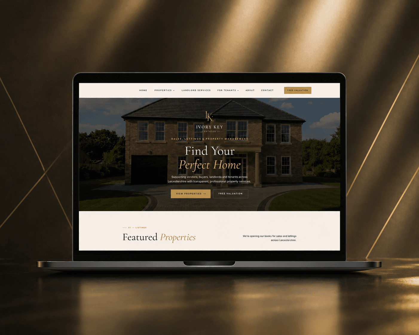 Ivory Key Estates website shown on a laptop
